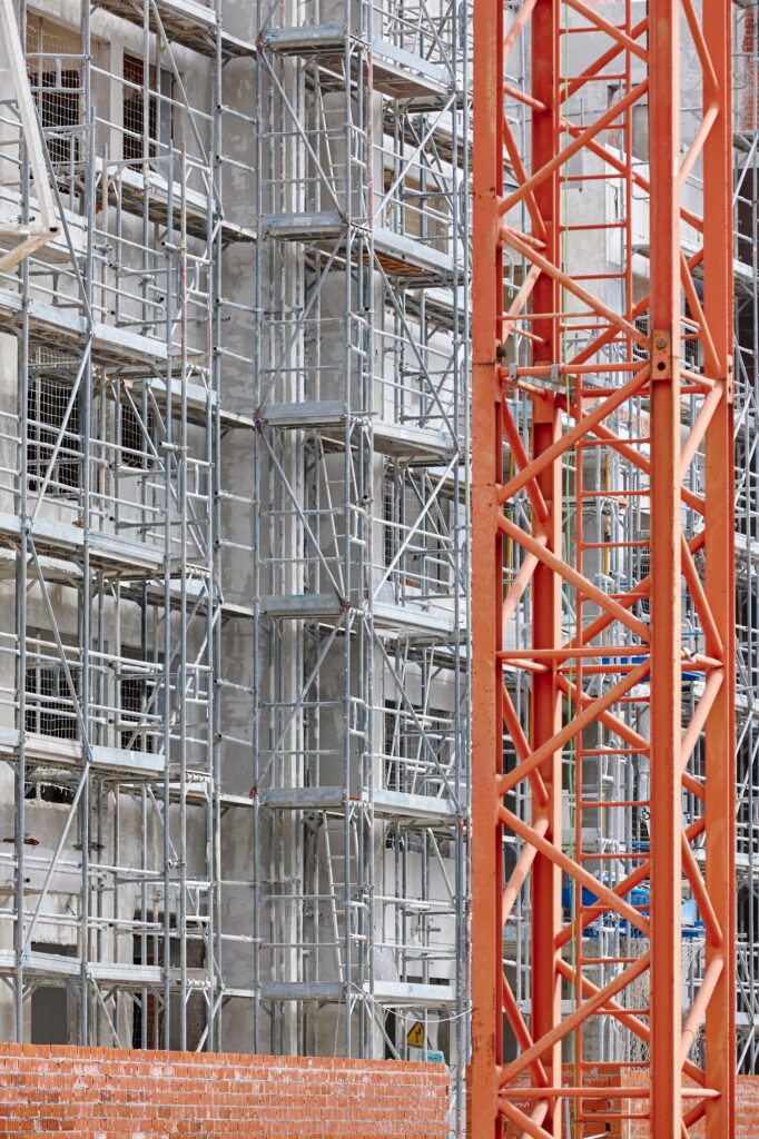 Building facade under construction. Concrete structure. Architecture. Vertical